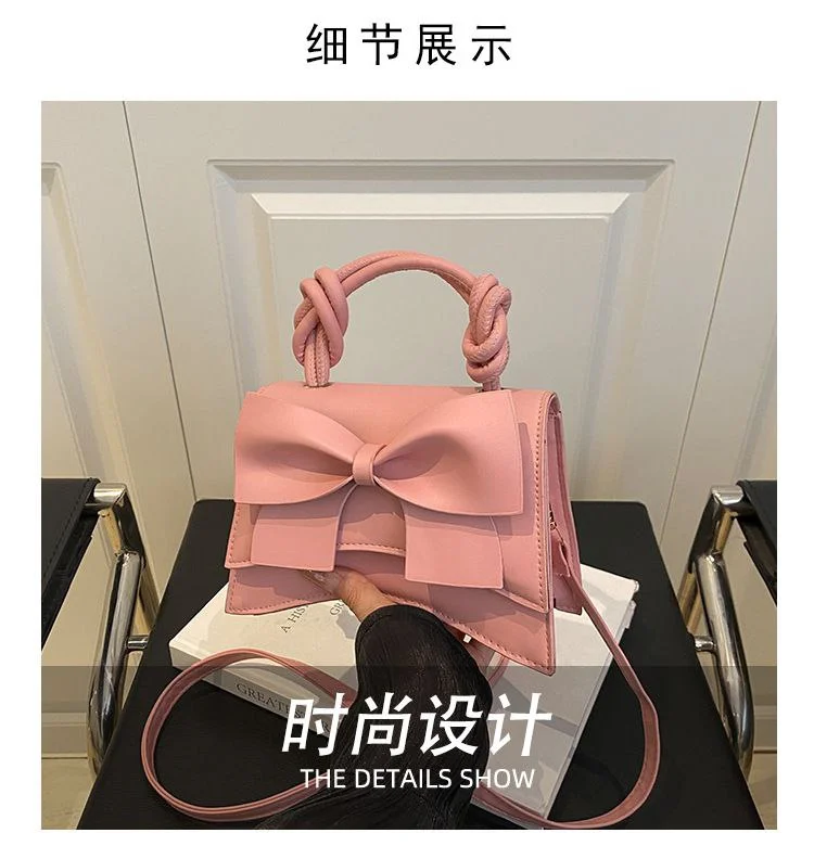 Elegant Bow-Embellished Handbag with Knotted Top Handle