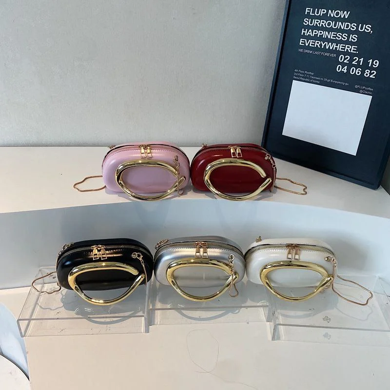 Modern Oval Clutch with Statement Gold-Tone Handle