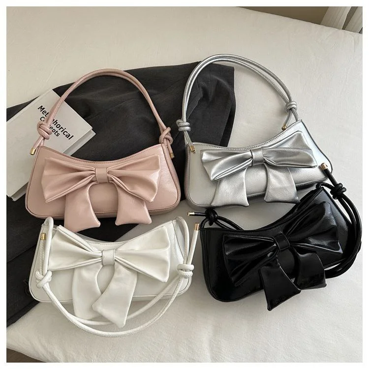 Chic Handbag with Silver Bow Detail